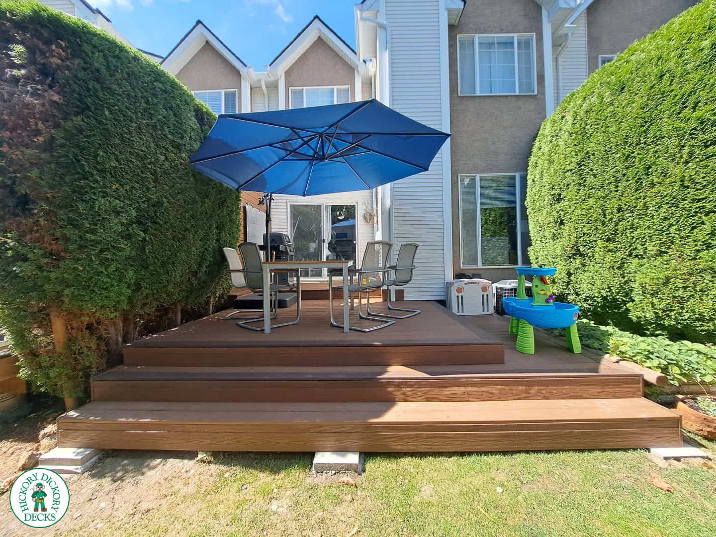 deck with cedar shrubs as privacy