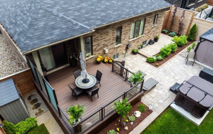 nicely landscaped yard and deck