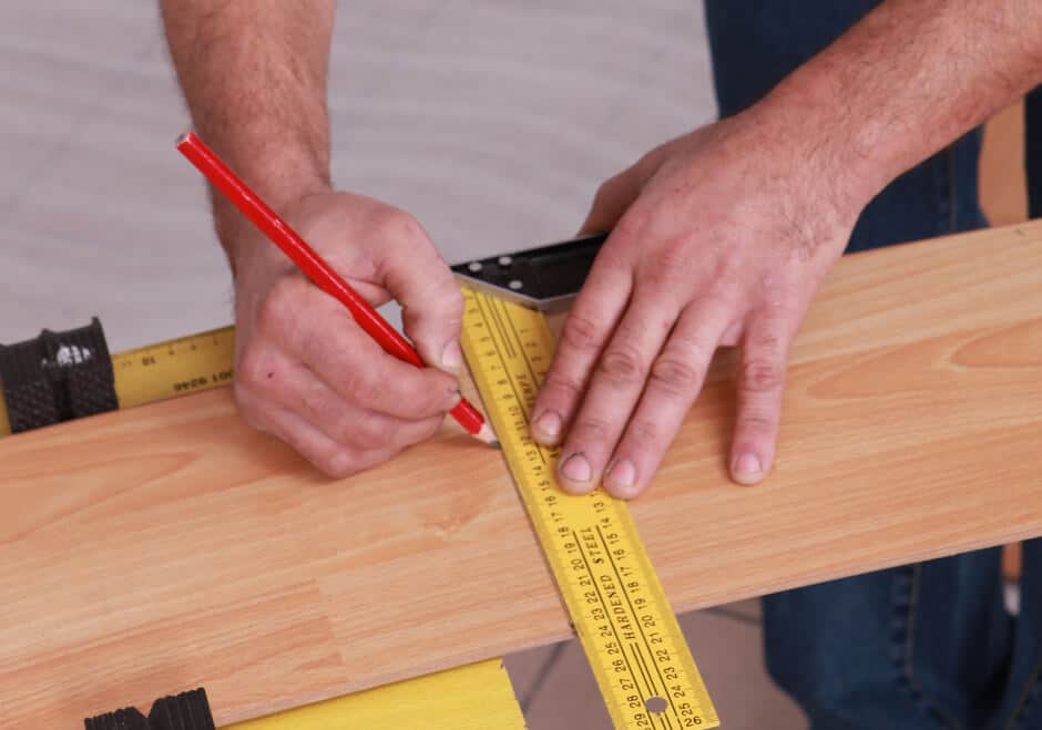 marking a deck board with pencil