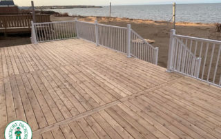 cedar deck overlooking beach and lake