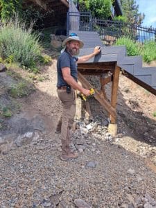 Man building deck staircase