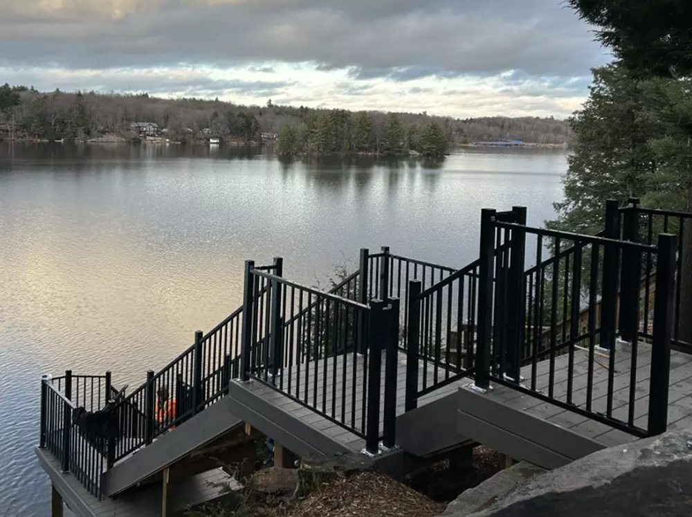 clubhouse pvc decking on staircase overlooking Healey Lake at sunset